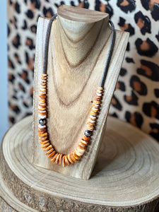 22 inch graduated orange spiny necklace with Sterling silver pearls